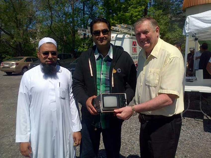 Imam Badat, Masjid Bilal Chairman Tahawar Mahmood Rana, and City Councillor Bob Monette during the mosque's e-waste recycling drive.