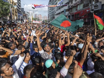 People gather in front of the Bangladesh Nationalist Party headquarters during a rally in Dhaka, Bangladesh, on Aug. 7, 2024.