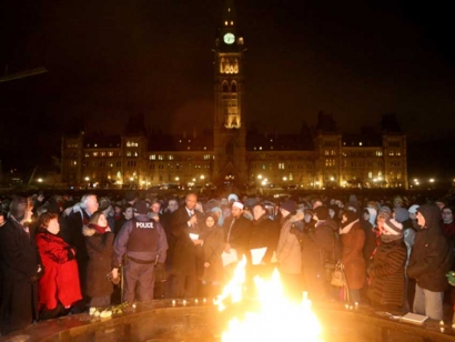 Members of Parliament gather with community members at the 2018 vigil after the one year anniversary of the Quebec Mosque Shooting.