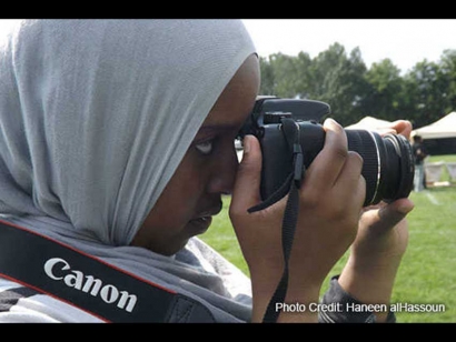 Sarah Musa takes photos at the Sadaqa Food Festival