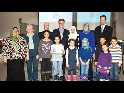 Kanata Muslim Women and Children Adopt a Park and Receive Recognition. For several years, a group of Muslim women and kids in Kanata have participated in the annual “Cleaning the Capital” Campaign. On Feb. 6, they were recognized by the City of Ottawa. A sign at Morgan&#039;s Grant Park identifies the area as “adopted” by Kanata Muslims. (L-R, back row to front): Amany Zahran, Councillor Marianne Wilkinson, John Manconi, Mayor Jim Watson, Mariam Refaie, Nadine El-Hawary, Bill Houldsworth, Farah Osman, Huda Osman, Fatima Darwish, Noura Dawoud, Aly Matrawy, Ibraheem Refaie, Noor Matrawy.