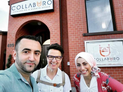 Collaburo co-owners Mohammad and Hanan take a selfie with their local city councillor, Catherine McKenney, in front of the new Events and Coworking space.