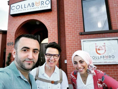 Collaburo co-owners Mohammad and Hanan take a selfie with their local city councillor, Catherine McKenney, in front of the new Events and Coworking space.