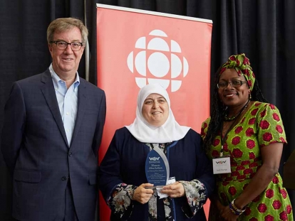 Hanan Abu Laban receiving her award with Mayor Jim Watson and Welcoming Ottawa Week Chair Sarah Onyango