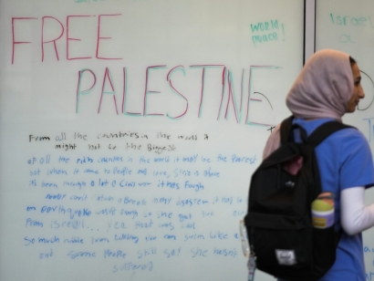 It’s important to understand both the possibilities and limitations of campus dialogue. A person walks past a board with the message ‘Free Palestine’ on the campus of Indiana University–Purdue University Indianapolis, Feb. 7, 2024, in Indianapolis.