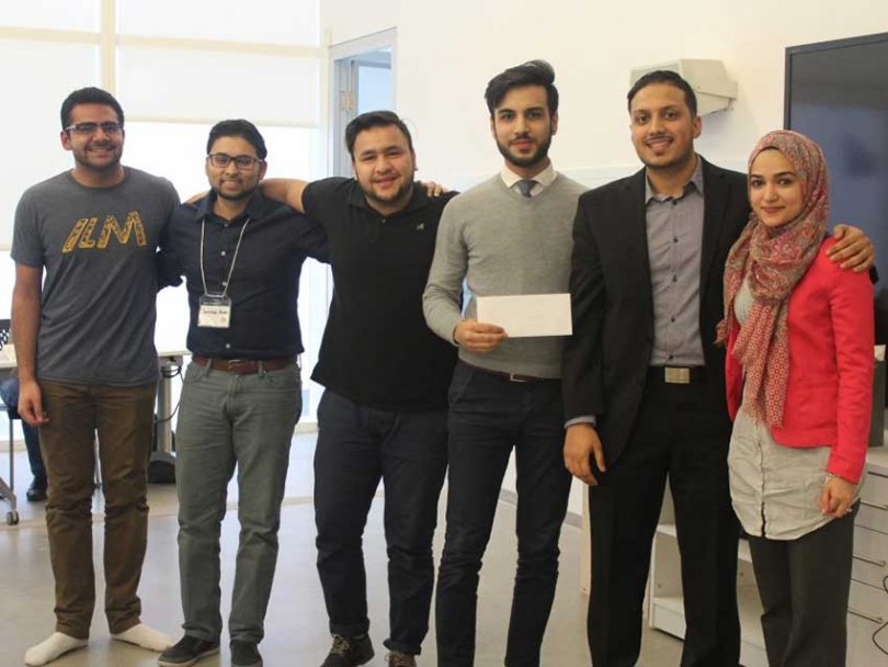 Davoud Sarfaraz (holding the envelope) and his team members won first prize at ILM Weekend for their product SeerahBOX.