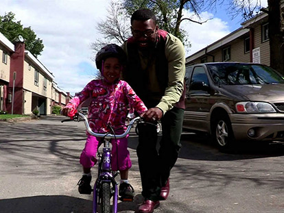 Jamal Rogers and his daughter HUSNIYAH, taken from the video of the same name.