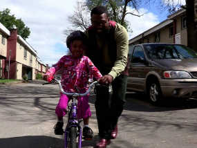 Jamal Rogers and his daughter HUSNIYAH, taken from the video of the same name.