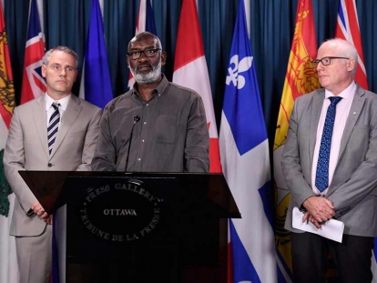Sudanese Canadian Abousfian Abdelrazik at a press conference with his lawyer Paul Champ and Amnesty International Secretary General Alex Neve in September 2018.