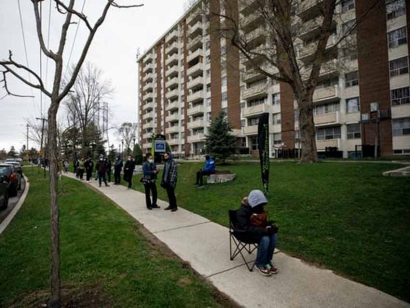 Residents of Toronto’s Jane and Finch neighbourhood line up at a pop-up vaccine clinic in April 2021. Residents of the area continue to struggle with the lowest vaccination rates in the city.