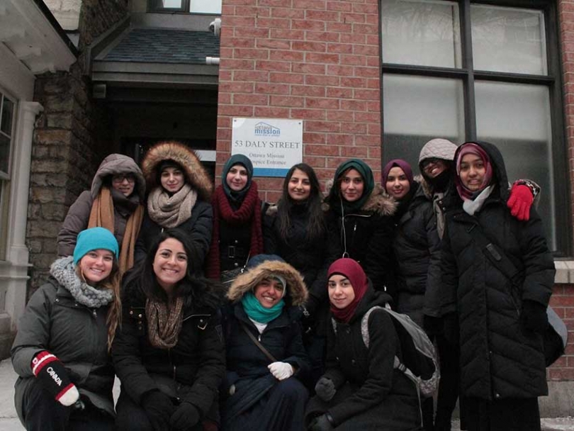 Members of Sunni and Shia Muslim students associations work together to help out the homeless.