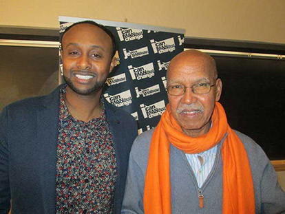 Crime Prevention Ottawa&#039;s Sharmaarke Abdullahi with novelist Nuruddin Farah, sporting a orange scarf in recognition of the 16 Days of Activism against Gender Violence.