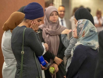 People wait to enter the courtroom for a hearing challenging Bill 21, July 9, 2019 in Montréal.