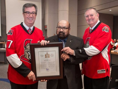 City Builder Award winner Qamar Masood with Mayor Jim Watson and Orléans Ward Councillor Bob Monette.