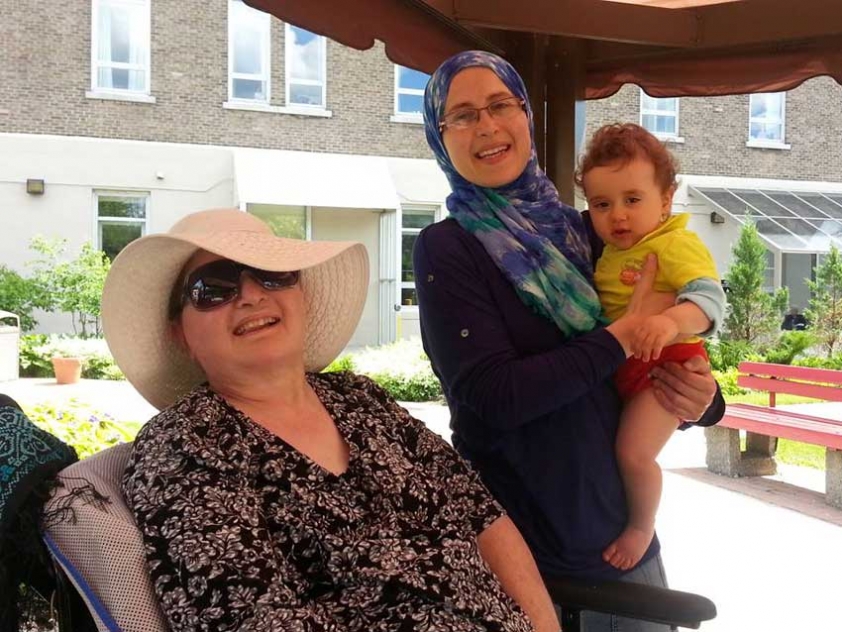 Amira Elghawaby with her mother Mona, and one of her children.