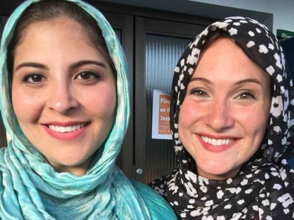 The author (right) with a friend, participating in a community iftar in Ottawa last year.