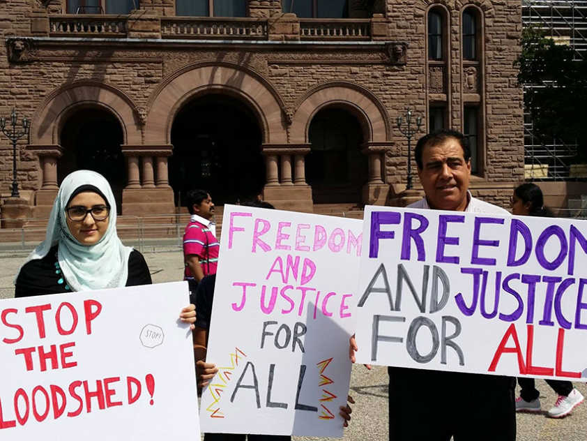 Izzeldin Abuelaish and his daughter Shatha at the July 15th vigil in Toronto