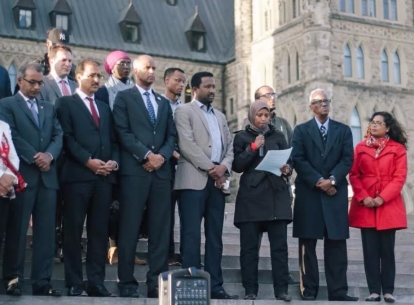 Farhia Ahmed speaks on Parliament Hill with MPs from all parties to mourn the victims of the recent terrorist attack in Mogadishu.