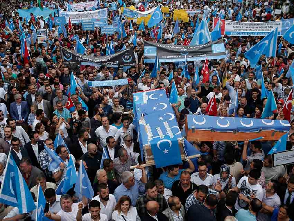 In this July 2015 photo, Uighurs living in Turkey and their supporters, some carrying coffins representing Uighurs who died in China’s far-western Xinjiang Uighur region, chant slogans as they stage a protest in Istanbul, against what they call oppression by the Chinese government against Muslim Uighurs in the province.