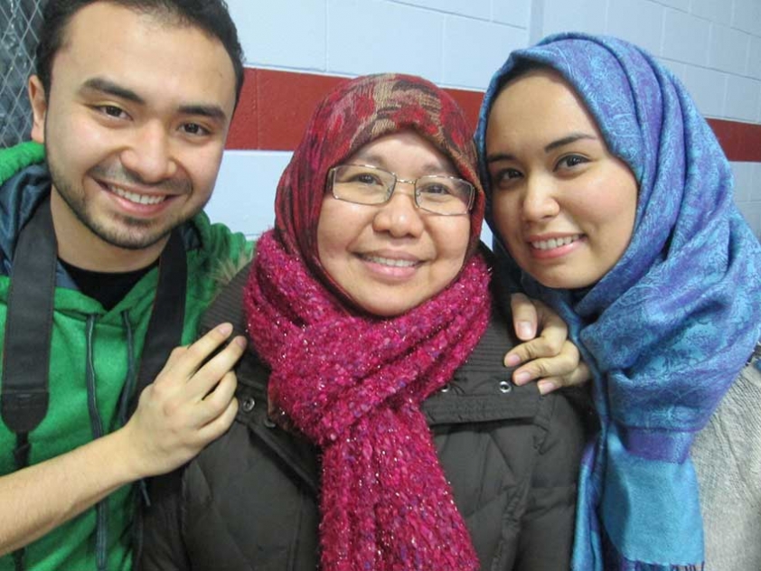 Mohammad Al Azzouni, Nesreen Lachica, and Salwa Al Azzouni at MAC&#039;s Canadian Family Day Event. Nesreen still has not taken off her winter coat or scarf.