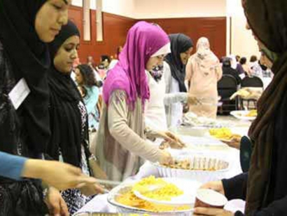 Guests at a community dinner hosted by the Amal Center for Women in Montreal.