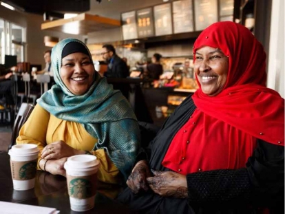 Amina Hussein, left, and Maryan Barrow in an interview at a coffee shop in Edmonton, on Friday, Feb. 8, 2019. The two mothers are part of a now year-old coalition of Somali mothers