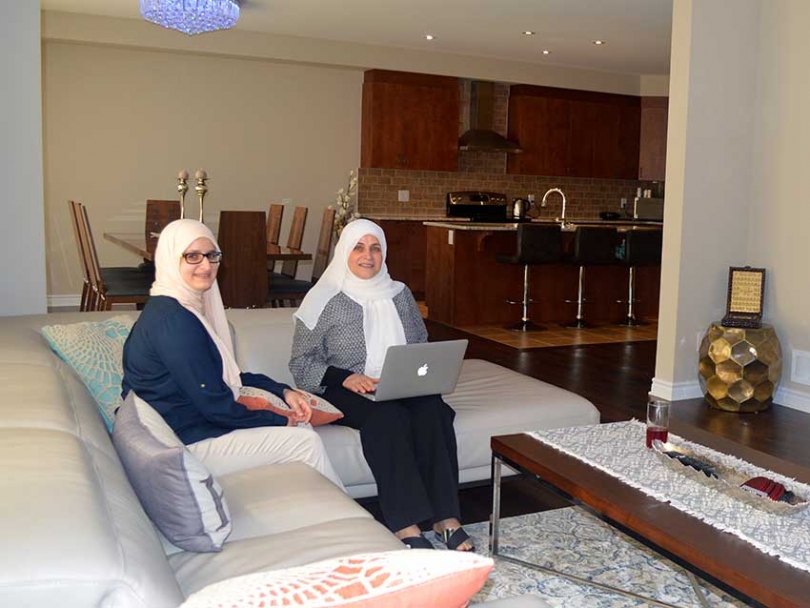 Sakna Bassam and her daughter in the family room of their Tartan home in Findlay Creek.