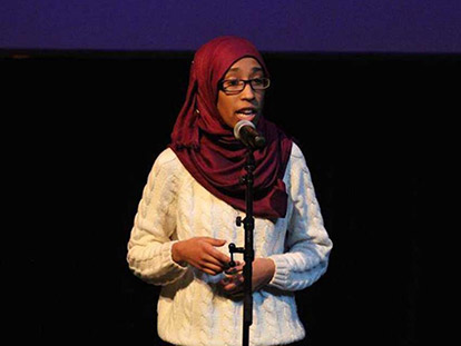 Roua Aljied performing &quot;Looking Over Her Shoulder&quot; at the Impact of Family Violence Conference in Ottawa.
