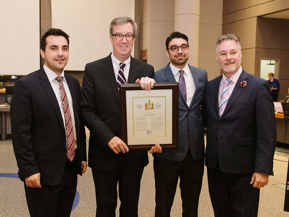Osman Naqvi receiving Ottawa&#039;s City Builder Award from Mayor Jim Watson and City Councillors Mark Taylor and Michael Qaqish