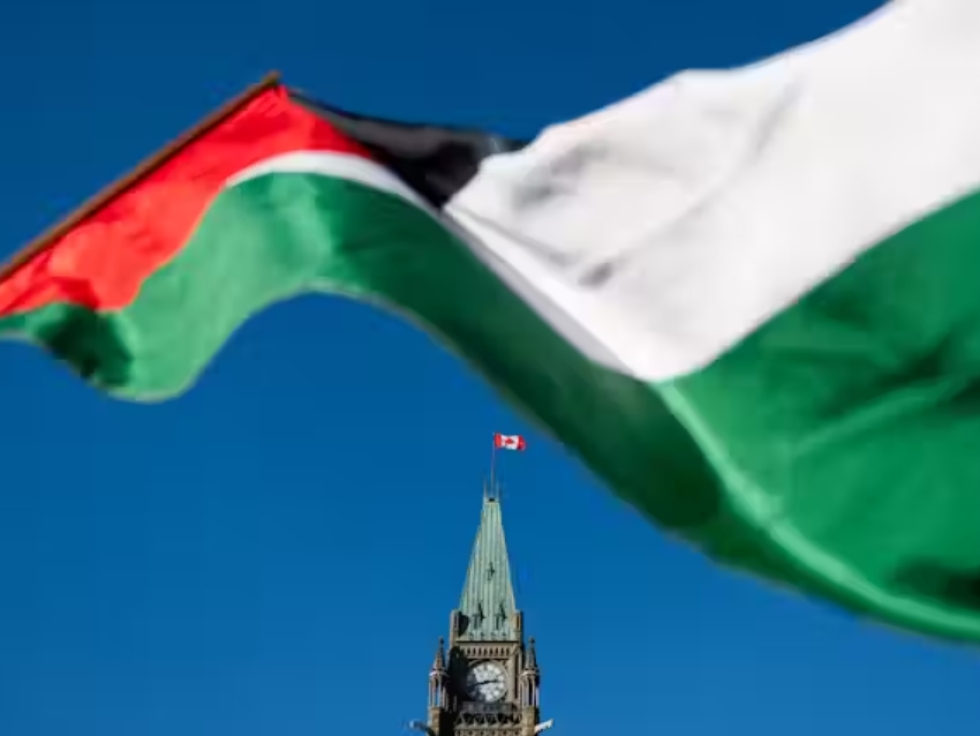 A Palestinian flag flies near the Peace Tower during a march for Gaza rally on Parliament Hill in Ottawa on Nov. 4, 2023.