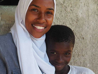 Haitian Canadian Fatima Estime with one of her students in the village of Desab, Haiti
