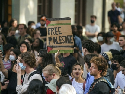 A student holds a ‘Free Palestine’ sign at a rally at the University of Texas April 24, 2024, in Austin, Texas, one of many gatherings following the arrest of more than 100 demonstrators at Columbia University protesting Israel’s war in Gaza