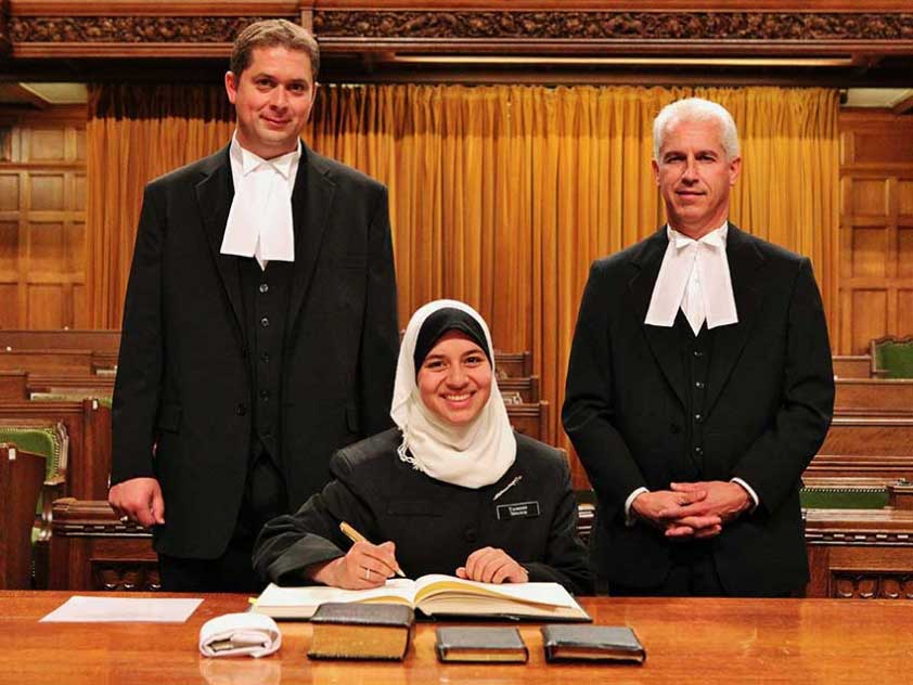 Parliamentary Page Yasmeen Ibrahim at her Swearing-In Ceremony. All Parliamentary personnel, including MPs, Clerks, Pages are expected to swear an oath to act in Her Majesty the Queen’s best interests, before they are allowed to work in the House of Commons.