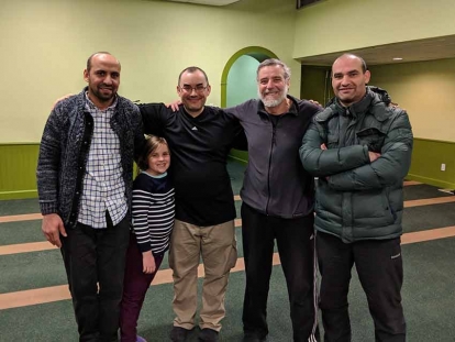 Ryan and Elisabeth with new friends Group picture with three new friends Saïd, Hakim and Ahmed at the Centre Culturel Islamique de Québec.