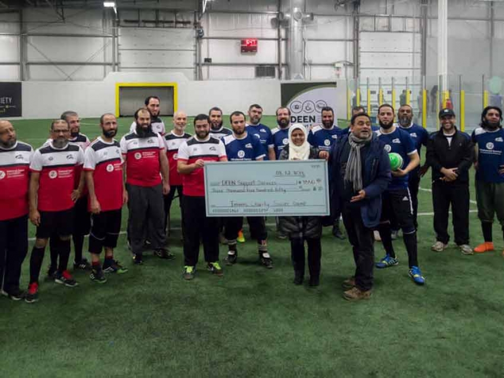 Imams presenting a cheque to Deen Support Services at the 2018 Imams Charity Soccer Game in Mississauga, Ontario.