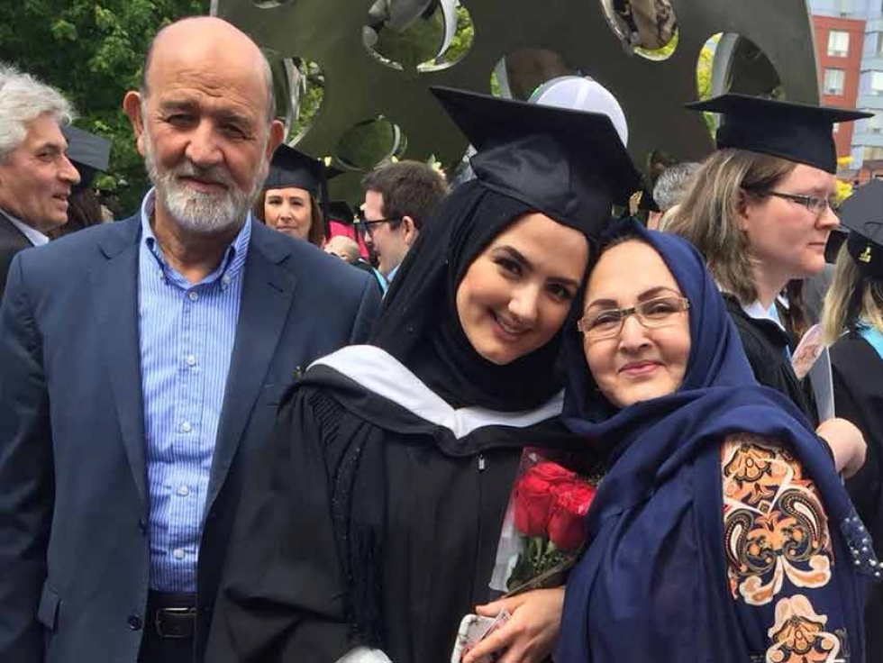 Sadaf Parweez with her parents at her UOIT graduation in June.