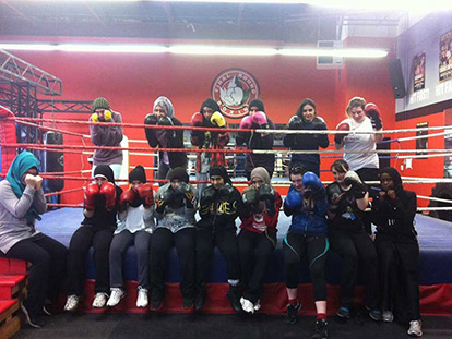 Aaida &quot;Mombasa&quot; Mamuji with participants in the Muslim Women&#039;s Boxing Program at Final Round.