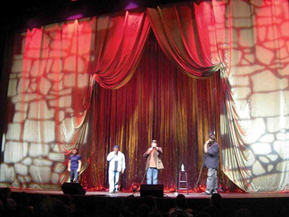 Stand-up comedians perform on stage at the annual MuslimFest.