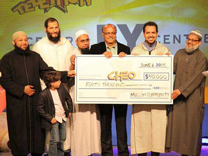 Local imams and leaders of Muslim organizations presenting CHEO with a donation on behalf of Ottawa&#039;s Muslim Community in 2016