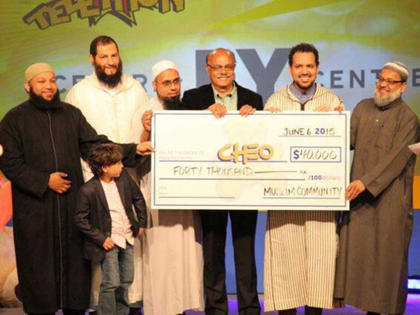 Local imams and leaders of Muslim organizations presenting CHEO with a donation on behalf of Ottawa&#039;s Muslim Community in 2016