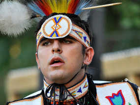 Shady Hafez in men’s traditional regalia at a Pow Wow.